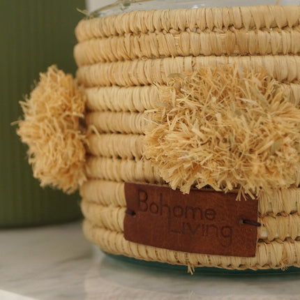 Bougie parfumée en raphia avec pompons - Senteur ambre