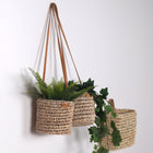 Cache pot suspendu en palme et cuir