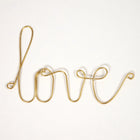 Mot en laiton doré - love