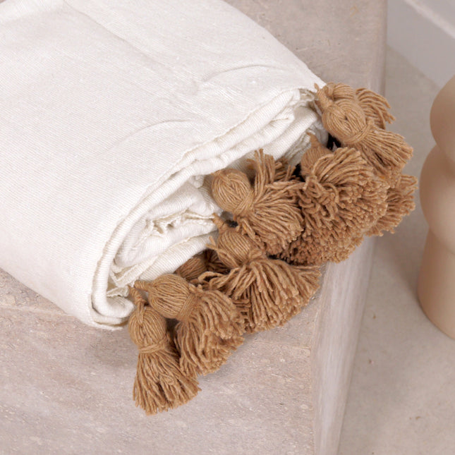 Plaid blanc à pompons marrons