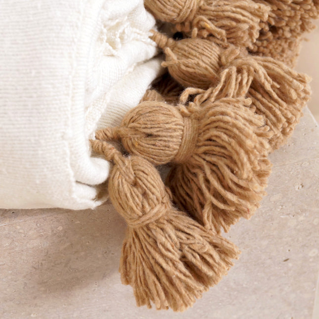 Plaid blanc à pompons marrons