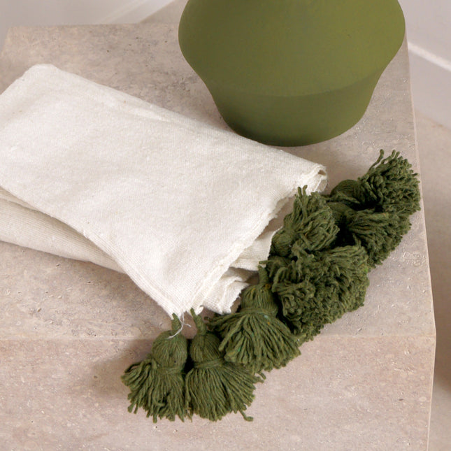 Petit plaid blanc à pompons verts