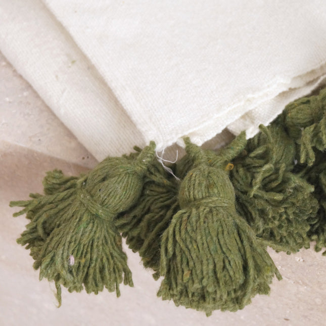 Petit plaid blanc à pompons verts