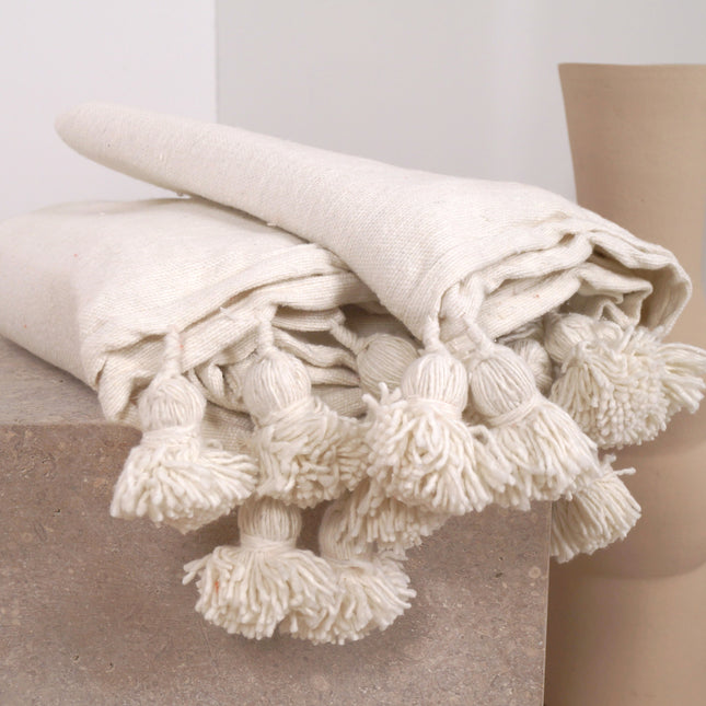 Plaid à pompons blanc