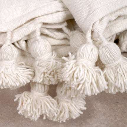 Plaid à pompons blanc