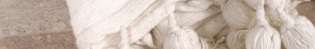 Plaid à pompons blanc
