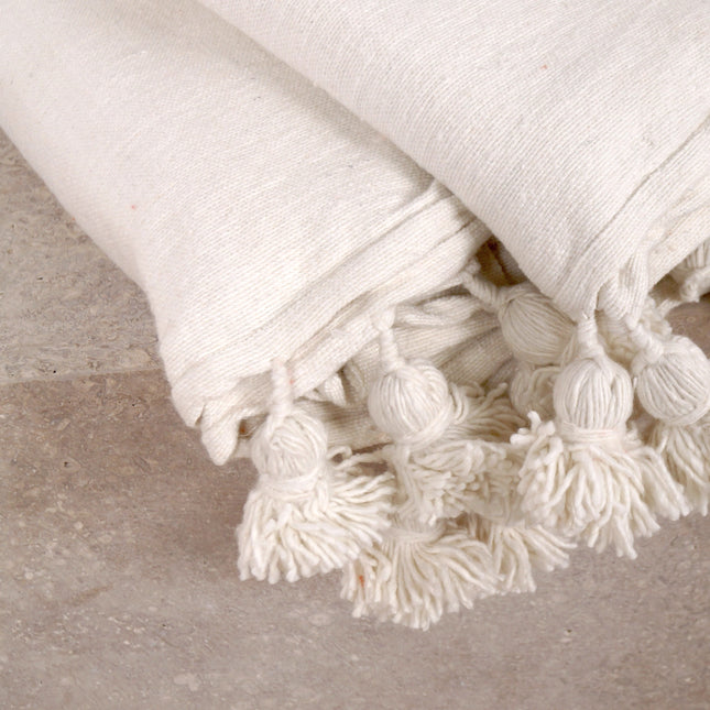 Plaid à pompons blanc