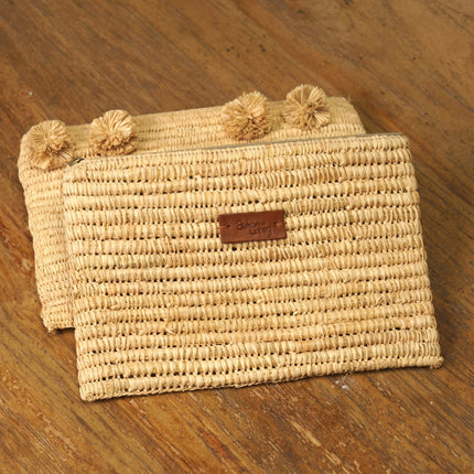 Pochette pour femme en raphia avec pompons