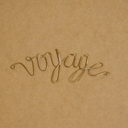 Mot en laiton doré - Voyage