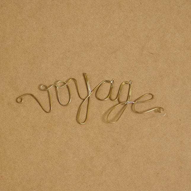 Mot en laiton doré - Voyage