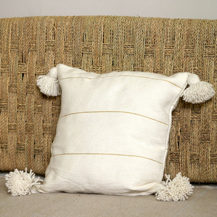 Coussin à pompons blanc rayures dorées
