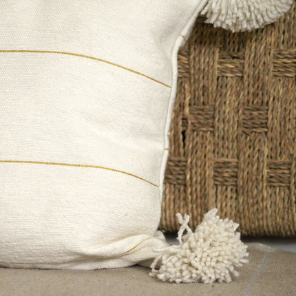 Coussin à pompons blanc rayures dorées