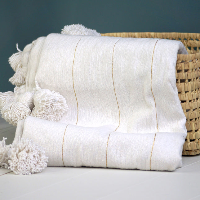 Plaid à pompons marocain blanc rayures dorées