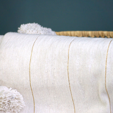 Plaid à pompons marocain blanc rayures dorées