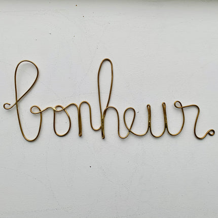 Mot en laiton doré - Bonheur