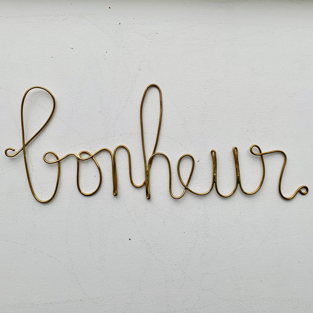 Mot en laiton doré - Bonheur