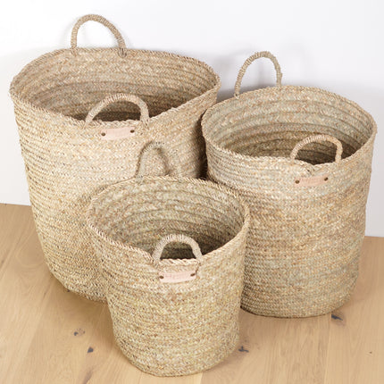 Trois paniers en osier tresse naturel pour ranger les affaires de la maison